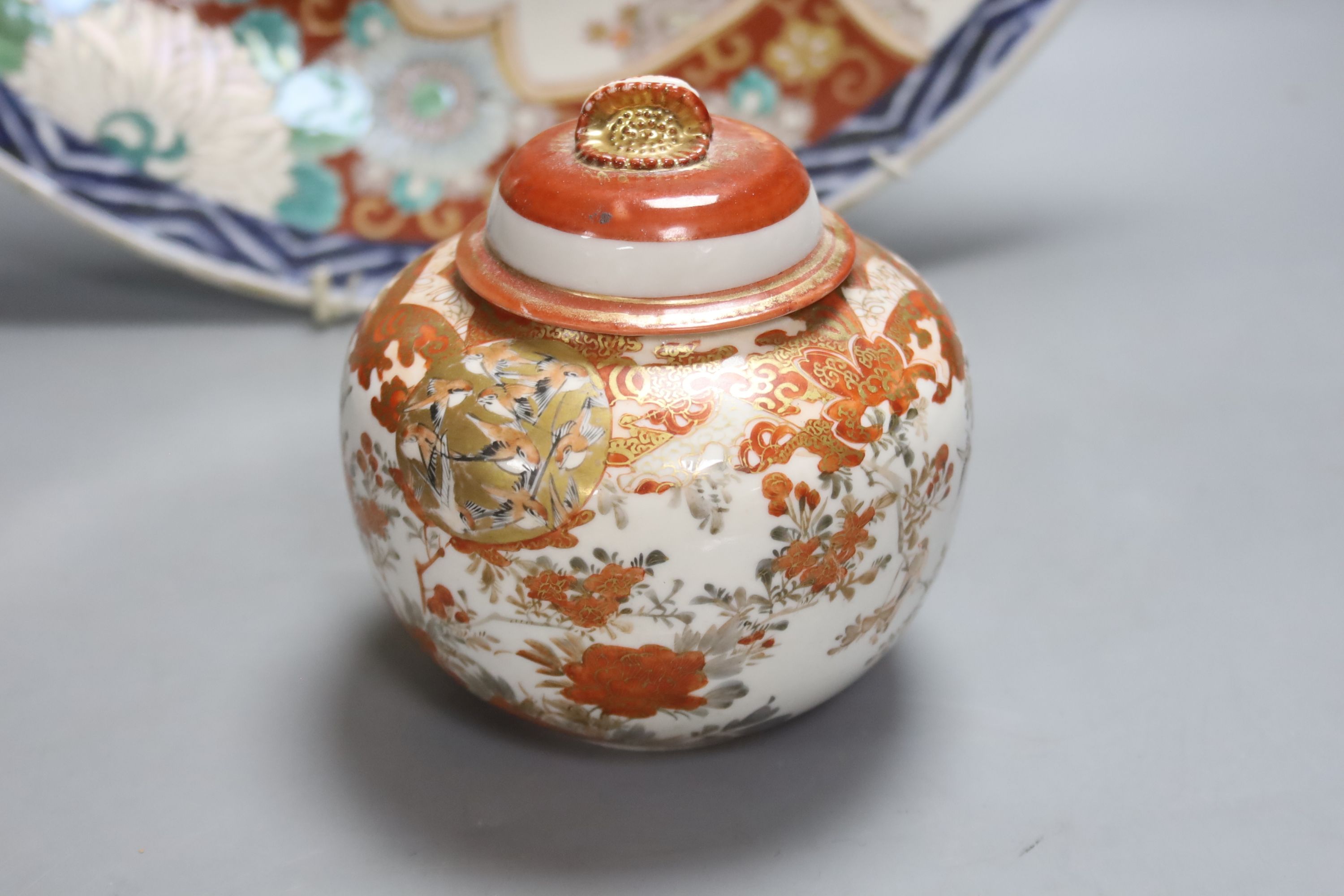 A Japanese Imari charger, a Kutani jar and cover and a Satsuma vase, diameter 40cm